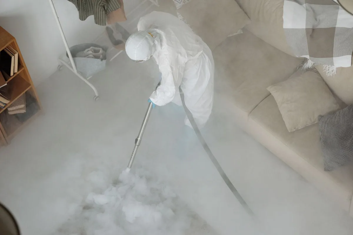 Biohazard cleanup technician in protective equipment, Pearl River, MS
